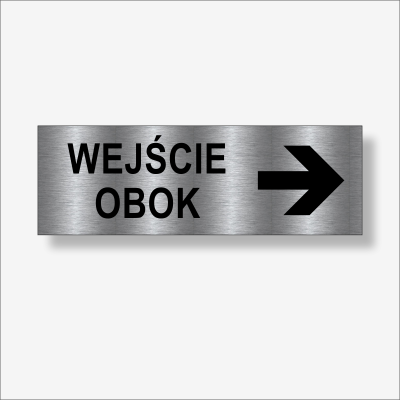 Wejście obok w prawo - tabliczka informacyjna na drzwi.