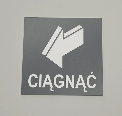 Ciągnąć aby otworzyć - tabliczka informacyjna kolor szary